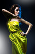 slim sexy woman in green dress and blue light