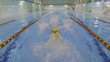 Caucasian swimmer a young man in pool starting from water