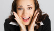 Surprised businesswoman, on gray