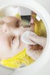 Beautician hands at face cleaning procedure