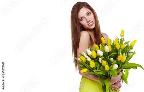 Photo: Pretty woman holding a bouquet of tulips Pretty woman holding a bouquet of tulips
