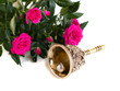 antique bronze bell and bouquet of roses