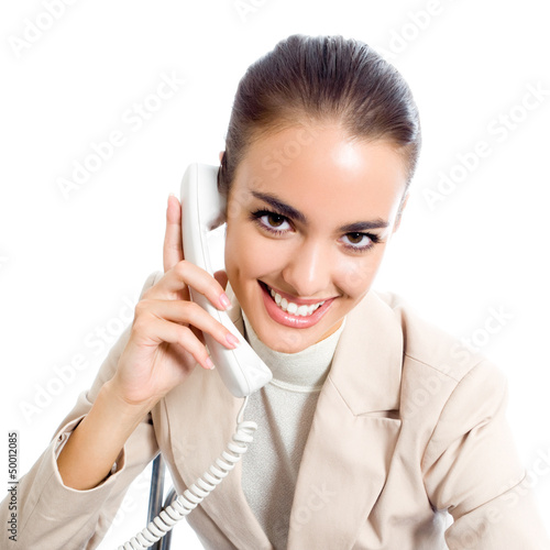 Photo: Businesswoman with phone, isolated Businesswoman with phone, isolated