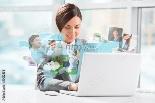 Photo: Business woman surfing on web with modern laptop Business woman surfing on web with modern laptop