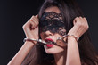 Dominating beauty in handcuffs