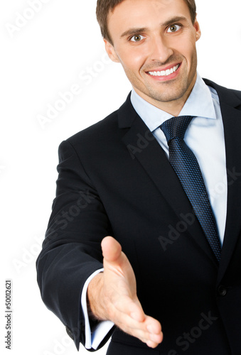 Photo: Business man giving hand for handshake, isolated Business man giving hand for handshake, isolated
