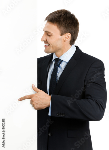 Photo: Businessman showing signboard, on white Businessman showing signboard, on white