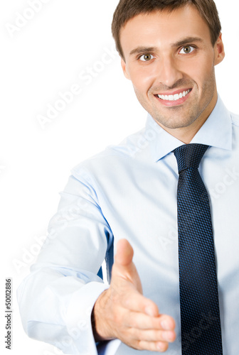 Photo: Business man giving hand for handshake, isolated Business man giving hand for handshake, isolated