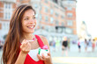 Happy tourist woman eating Ice cream in Quebec