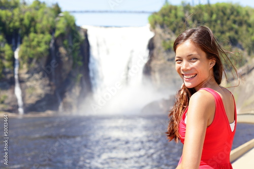 Photo: Quebec chute Montmorency falls and woman tourist Quebec chute Montmorency falls and woman tourist