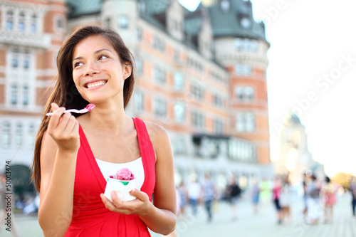 Photo: Tourist woman eating ice cream in Quebec City Tourist woman eating ice cream in Quebec City