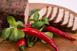 slices of fillet of pork with chili and lettuce around