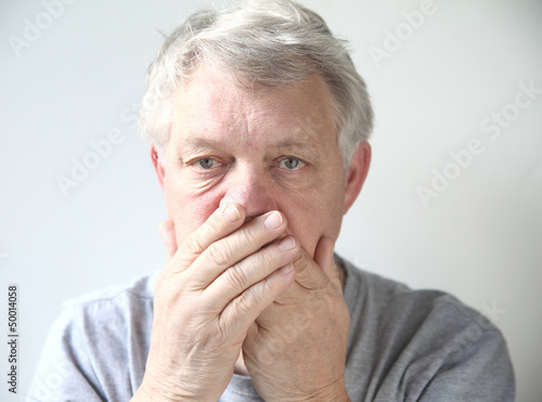 Photo: man worried about his bad breath man worried about his bad breath