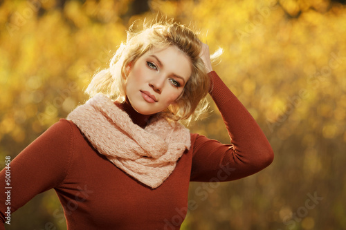 Photo: Young blond woman in autumn forest Young blond woman in autumn forest