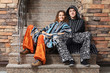 Photo: Young hippie couple sitting on the steps Young hippie couple sitting on the steps