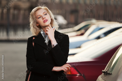 Photo: Young woman walking on the street Young woman walking on the street