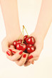 Hands with red cherry