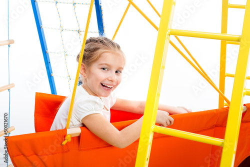 Photo: Little girl on a playground Little girl on a playground