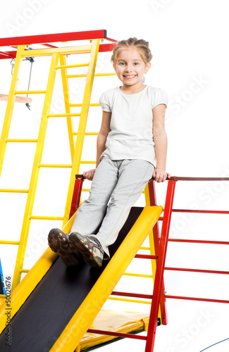 Photo: Little girl on a playground Little girl on a playground