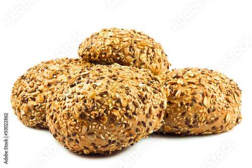 Photo: round wholemeal bread. resh buns with different seeds. round wholemeal bread. resh buns with different seeds.