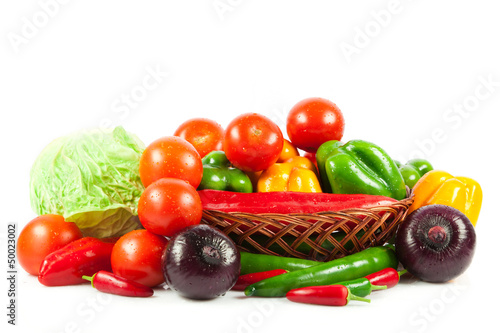 Photo: Fresh vegetables in basket isolated on white. Bio Vegetable. Co Fresh vegetables in basket isolated on white. Bio Vegetable. Co