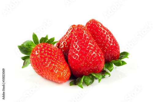 Photo: Strawberries with leaves. Isolated on a white background. Strawberries with leaves. Isolated on a white background.