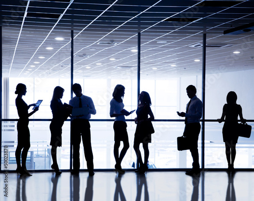 Photo: silhouettes of businesspeople silhouettes of businesspeople