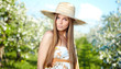Photo: beautiful blonde in a spring garden beautiful blonde in a spring garden