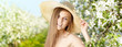 Spring woman in summer dress walking in park enjoying the sun.