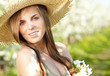 Spring woman in summer dress walking in park enjoying the sun.