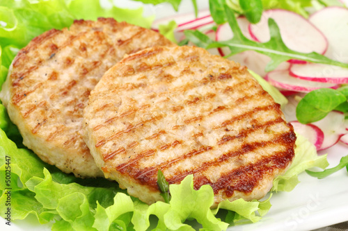 Photo: Grilled rabbit burgers with lettuce and radish salad Grilled rabbit burgers with lettuce and radish salad