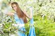 beautiful brunette woman in the park on a warm spring day
