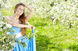 beautiful blonde in a spring garden