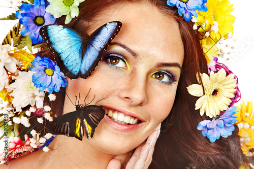 Photo: Woman with flower and butterfly. Woman with flower and butterfly.