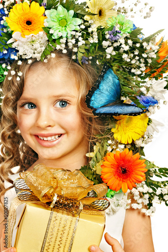 Photo: Child with gift box and flower. Child with gift box and flower.