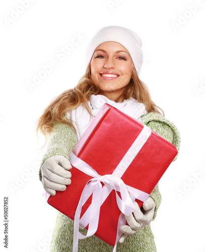 Photo: Beautiful woman holding gift isolated on white background Beautiful woman holding gift isolated on white background