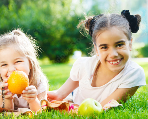 Photo: Happy little girls in the park Happy little girls in the park