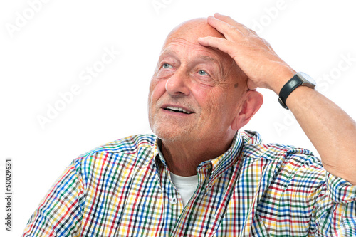 Photo: Happy smiling senior man looking up - isolated over white Happy smiling senior man looking up - isolated over white