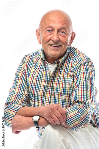 Photo: Portrait of a happy senior man smiling isolated on white Portrait of a happy senior man smiling isolated on white