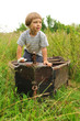 Cute boy playing in a boat