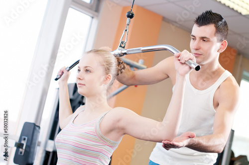 Photo: Gym man and woman doing exercise Gym man and woman doing exercise