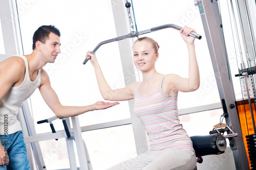 Photo: Gym man and woman doing exercise Gym man and woman doing exercise
