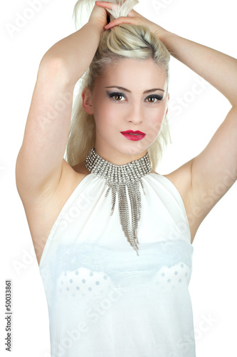 Photo: Beautiful young woman with diamond necklace holding her hair up, Beautiful young woman with diamond necklace holding her hair up,