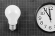 Lamp on blank school board and clock