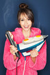 Woman frying eggs and bacon on an iron and hair straightener