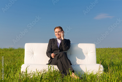 Photo: Business woman with touch pad and phone Business woman with touch pad and phone