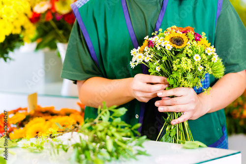Photo: Female florist in flower shop Female florist in flower shop
