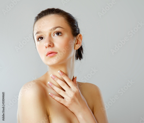 Photo: A portrait of a beautiful woman isolated on white background A portrait of a beautiful woman isolated on white background