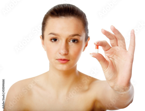 Photo: Young woman showing a tablet-isolated on white Young woman showing a tablet-isolated on white