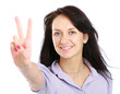 happy excited young woman showing the sign of victory